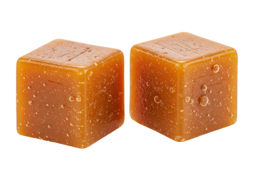 Isolated tasty caramel cubes, close-up confectionery treats, fudge candies, sweets for special occasions