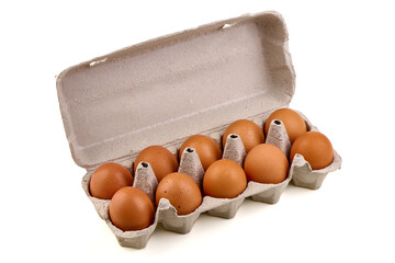 A dozen brown eggs sit snugly inside a recycled cardboard egg carton, isolated on white background.