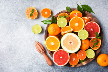 Assortment of colored citrus fruits: tangerine, grapefruit, lime and orange. Top view. Citrus fruits.