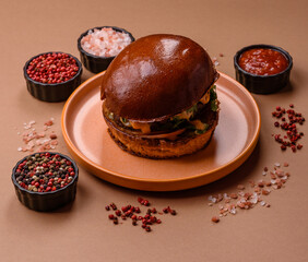 A burger, a hamburger with cheese, beef, and a bun, is unhealthy takeaway food. A burger