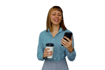 Happy young woman standing, smiling, messaging on a mobile phone and drinking coffee. Transparent background for easy use