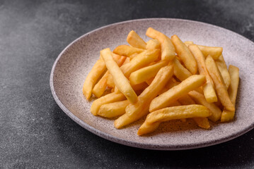 French fries are salty, crispy, and fried in oil, unhealthy takeaway food. French fries
