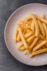French fries are salty, crispy, and fried in oil, unhealthy takeaway food. French fries