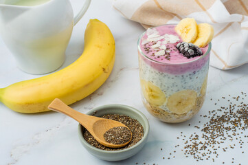 Chia pudding in a glass with berries and fruit. A light, quick breakfast, vegetarian, and healthy. Horizontal.