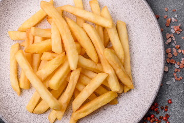 French fries are salty, crispy, and fried in oil, unhealthy takeaway food. French fries