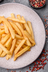 French fries are salty, crispy, and fried in oil, unhealthy takeaway food. French fries