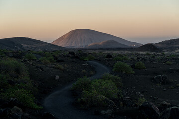 sunset in the volcano landscape of Timanfaya in Lanzarote