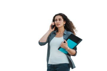 Businesswoman walking outdoors, talking on phone, holding a folder and tablet, with on transparent background