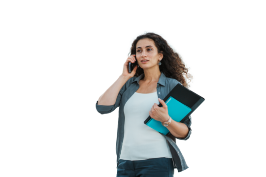 Businesswoman walking outdoors, talking on phone, holding a folder and tablet, with on transparent background