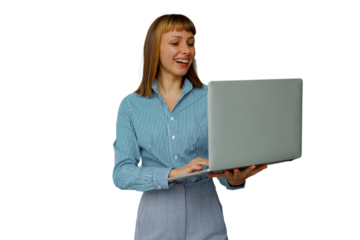 Woman standing and working on laptop, smiling and typing representing remote work and professional communication