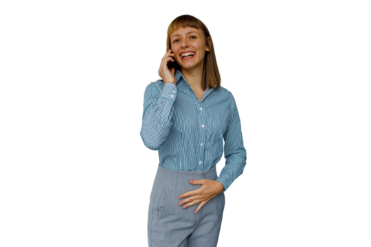 Happy young woman laughing and talking on mobile phone, enjoying conversation for business or personal call - Powered by Adobe