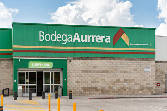 Worn facade of the Bodega Aurrera store, people leaving the Aurrera super market, Guadalajara, Jalisco, Mexico, October 13, 2025.