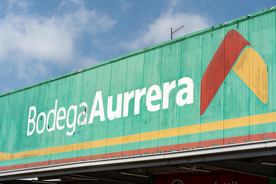 Worn facade of the Bodega Aurrera store, people leaving the Aurrera super market, Guadalajara, Jalisco, Mexico, October 13, 2025.