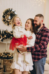 Happy family celebrating christmas together at home