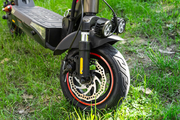 Electric scooter front wheel with disc brake and dual headlights, electric scooter concept