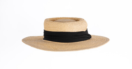 Women's straw hat with a black ribbon isolated on white background