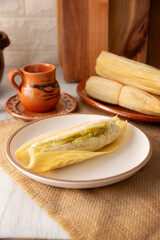 Tamales. Traditional food typical of Mexico and some Latin American countries. Corn dough wrapped in corn leaves. The tamales are steamed.