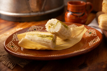 Tamales. Traditional food typical of Mexico and some Latin American countries. Corn dough wrapped in corn leaves. The tamales are steamed.