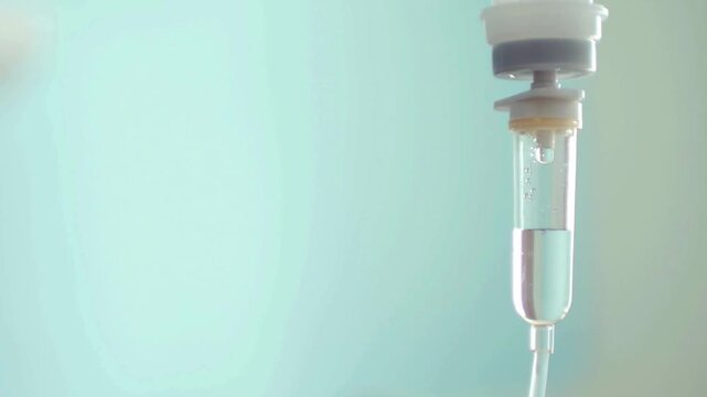 IV Drip in Hospital for Patient &ndash; Medical Concept of Intravenous Therapy with Saline Solution Dripping Through Tube for Treatment, Recovery, and Healthcare Support in Modern Clinic in 4K Ultra HD