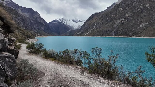 Huaraz, Peru : Panoramic footage of the hiking trail by laguna paron in Huaraz, Peru with cordillera blanca mountain peak in the front