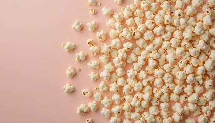 Top view of popcorn arranged in circular pattern on pastel backdrop.