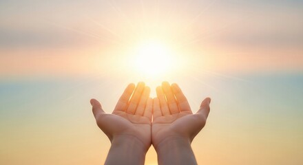 Reach for the light: A pair of hands cupped towards a brilliant sun, inviting introspection, conveying a sense of hope and spirituality.