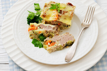Cheesy ground meat vegetables casserole on a plate