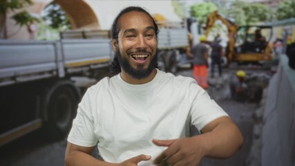 Man shielding eyes with hand and pointing finger toward workers by building at an outdoor construction site; laughter camaraderie optimism.