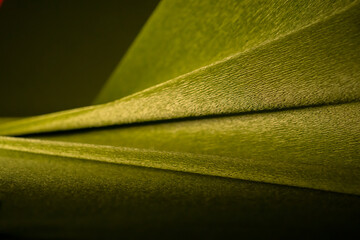 Abstract background made of crepe paper in shades of green