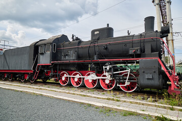 A Classic Steam Locomotive is proudly displayed in an Urban Setting for all to see and admire