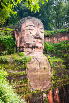 The ancient Leshan Giant Buddha, carved from mountainside sandstone, is a popular tourist excursion from Chengdu, China.