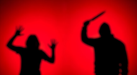 Silhouette of a man holding a knife over a woman against a red background. Violence, crime, and domestic abuse or news concept banner with copy space.