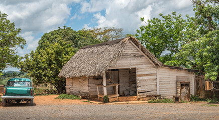 Cuban country shack and vintage car