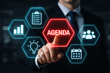 Business man pointing at glowing red agenda button surrounded by planning, reporting, idea, calendar, and people icons representing meeting preparation and action items