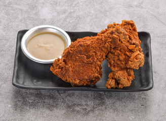 Spicy Hot Chicken with Gravy Two pieces of crispy fried chicken with spicy seasoning