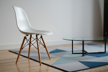Modern white chair and geometric rug in a minimalist living room