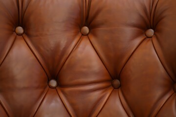 Close up of rich brown tufted leather upholstery with diamond pattern