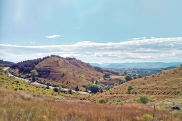 Obraz premium Scenic landscape view of rolling green hills. Peaceful countryside scene with natural contours and vast open spaces