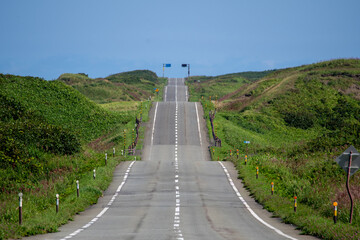 A road with many ups and downs through the hills