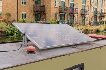 Solar panel generating sustainable electricity on a narrowboat, showcasing green living on regent's...