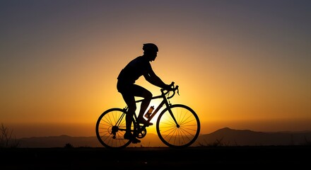 Fototapeta premium Silhouette of a Cyclist Riding Bicycle Against a Sunset Sky with Dramatic Warm Tones