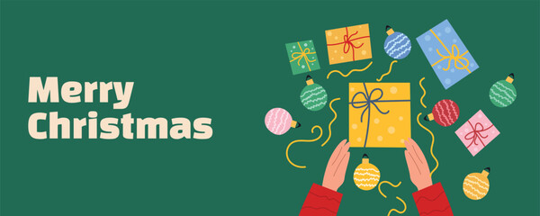 Holiday banner with hands holding gift boxes, surrounded by Christmas decorations, baubles, and confetti on green background. Ideal for festive greetings, winter sale banners, and web design