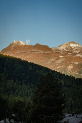 Full Moon Over Swiss Alps at Sunset