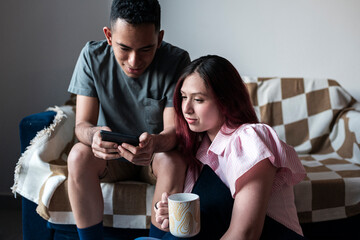 Diverse students reading digital e-book together