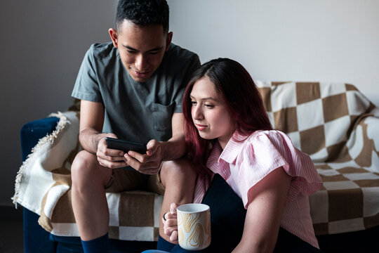 Diverse students reading digital e-book together