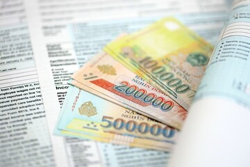 Vietnamese dong money bills on tax form close up. Taxation and accounting concept