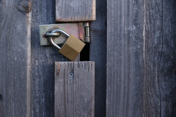 A wooden door with a lock on it