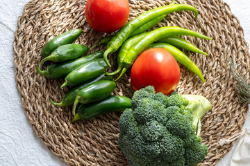 Close-Up of Green Vegetables and Tomatoes: Broccoli, Cucumber, and Pepper

