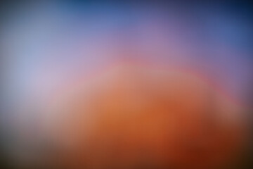 Warm orange gradient background with smooth transitions to deep red and brown tones, evoking a...