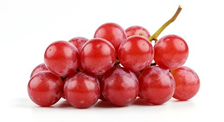 A fresh bunch of ripe and juicy red table grapes with a small stem isolated on a white background